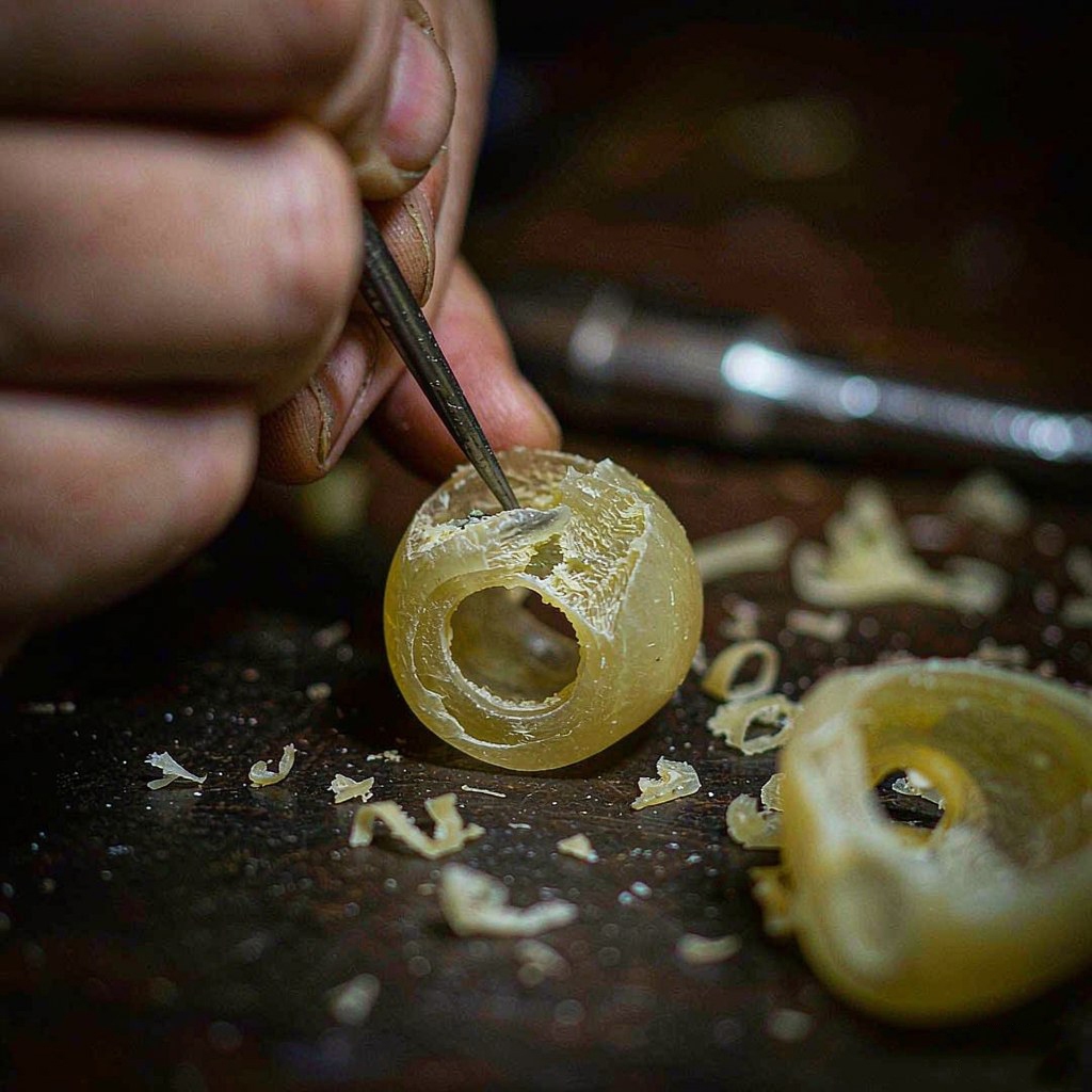 Hand carving a ring wax model with a graver tool